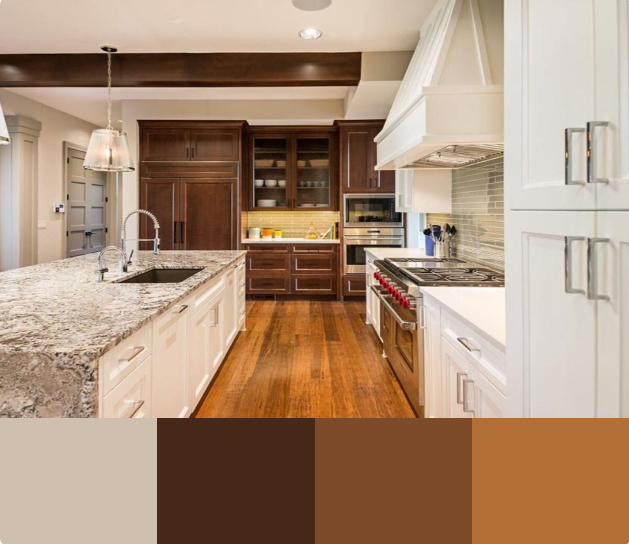 A spacious kitchen with white cabinets and a large granite countertop island. The kitchen features dark wood flooring, cabinets, and a decorative beam.