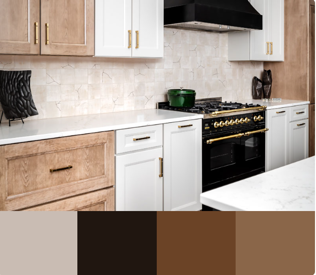 A modern kitchen with a mix of white and warm wood cabinets, featuring a white quartz countertop and a black range. The backsplash is a neutral, textured tile.