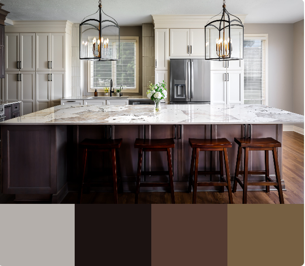 A spacious kitchen with white cabinets and a large marble countertop island. The island features a dark wood base and counter-height seating with wooden stools. Gold pendant lights hang above the island.