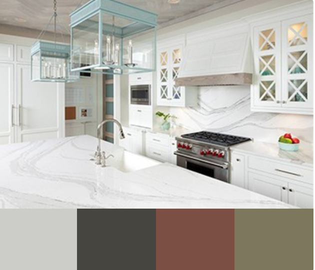 A bright and airy kitchen with white cabinets and a large marble countertop island. The backsplash features a white subway tile, and the range hood is a wood-toned vent hood. The kitchen has a coastal vibe with blue pendant lights.