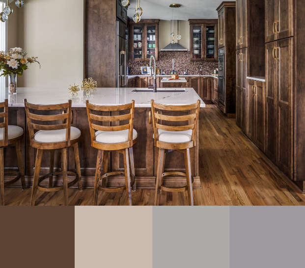 A warm and inviting kitchen with dark wood cabinets, a white marble countertop island, and a mix of gold and bronze accents. The kitchen features a breakfast bar with four wooden counter stools and a view into the main kitchen area.