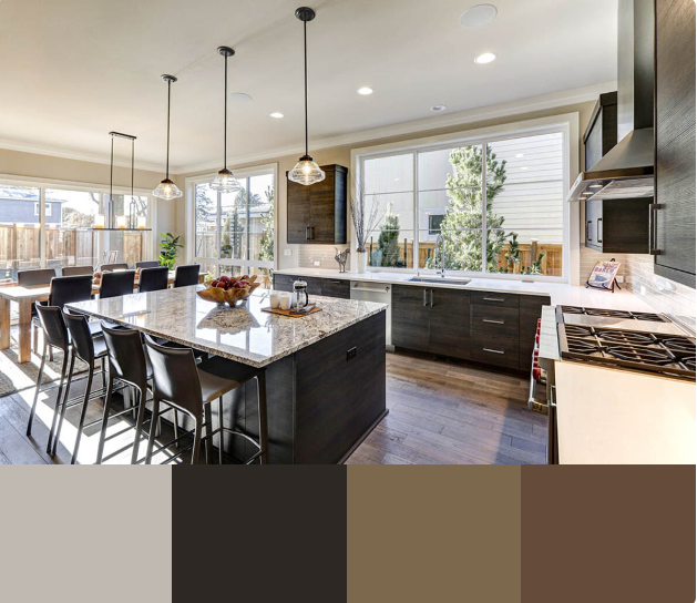 A modern kitchen with dark wood cabinets, a large white quartz countertop island, and a mix of gold and bronze accents. The kitchen features a breakfast bar with four wooden counter stools and a view into the main kitchen area.