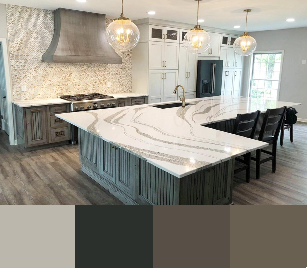 A modern kitchen with white cabinets and a large, curved kitchen island featuring a dramatic white and gray veined countertop. The backsplash is a textured stone mosaic, and the pendant lights are a mix of gold and clear glass.